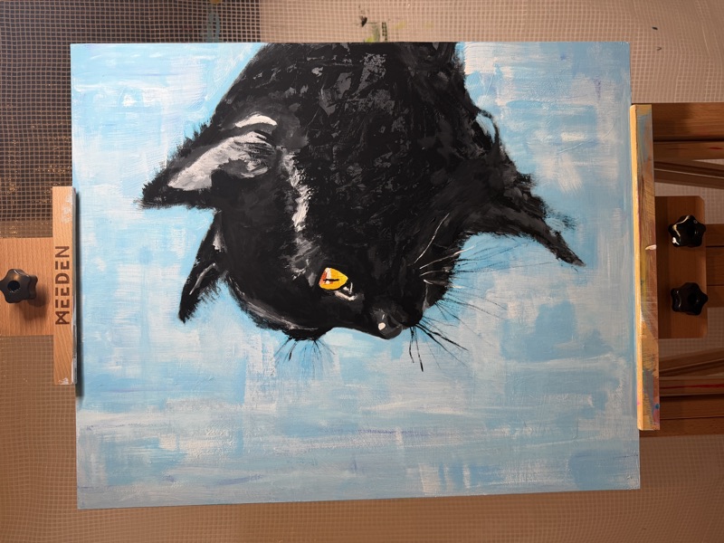 イーゼルに立てた黒猫の原画